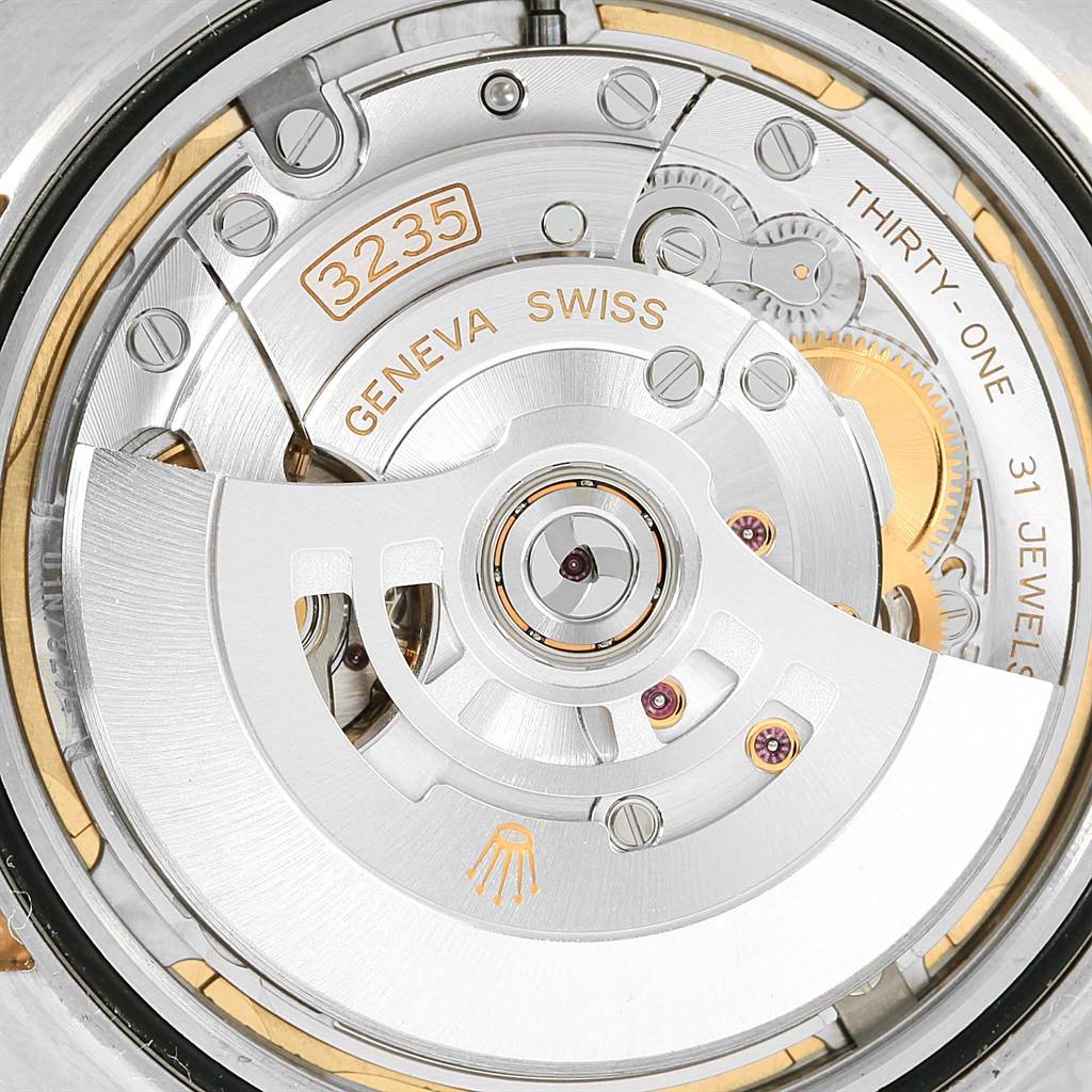 The image shows the detailed movement and internal mechanism of the Rolex Datejust 41 126333 Men's Steel and Gold (two tone) Champagne Dial 126333 Men's Steel and Gold (two tone) Champagne Dial model, highlighting the rotor and jewels.