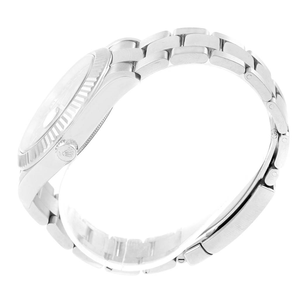 This side view of the Rolex Datejust 41 116334 Men's Stainless Steel Blue Dial 116334 Men's Stainless Steel Blue Dial showcases the watch case, bracelet, and crown.