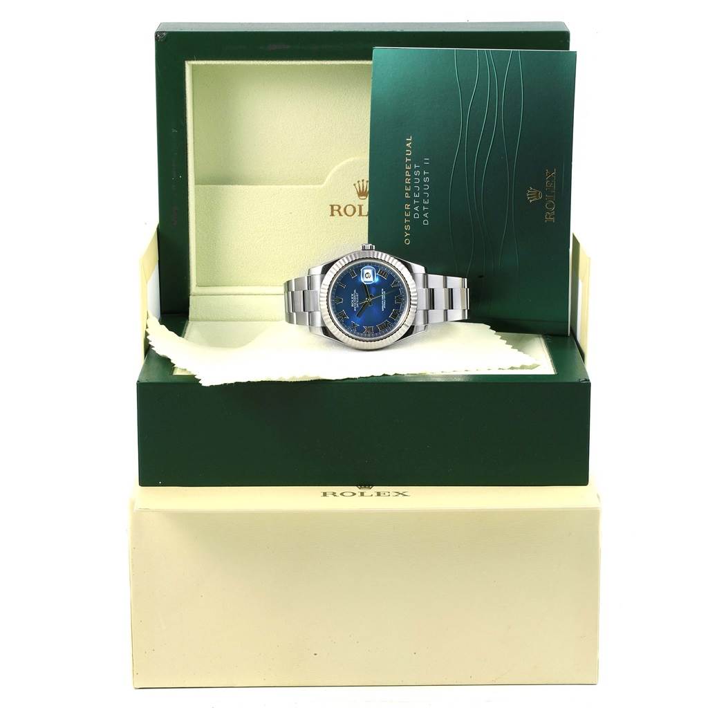 The Rolex Datejust 41 116334 Men's Stainless Steel Blue Dial 116334 Men's Stainless Steel Blue Dial watch is shown front-on, in its box with papers and cleaning cloth.