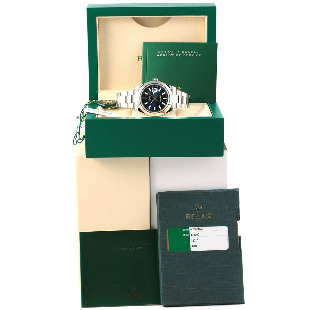 The image shows a Rolex Datejust 41 116300 Men's Stainless Steel Blue Dial 116300 Men's Stainless Steel Blue Dial watch, its box, warranty booklet, and accessories from a frontal angle.