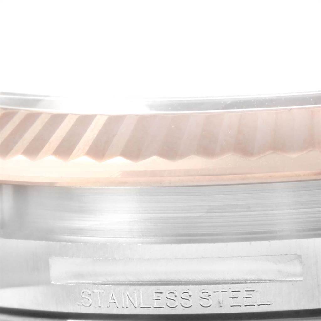 The image shows a close-up of the fluted bezel and part of the case of a Rolex Datejust 41 126331 Men's Steel and Gold (two tone) Pink Dial 126331 Men's Steel and Gold (two tone) Pink Dial watch.