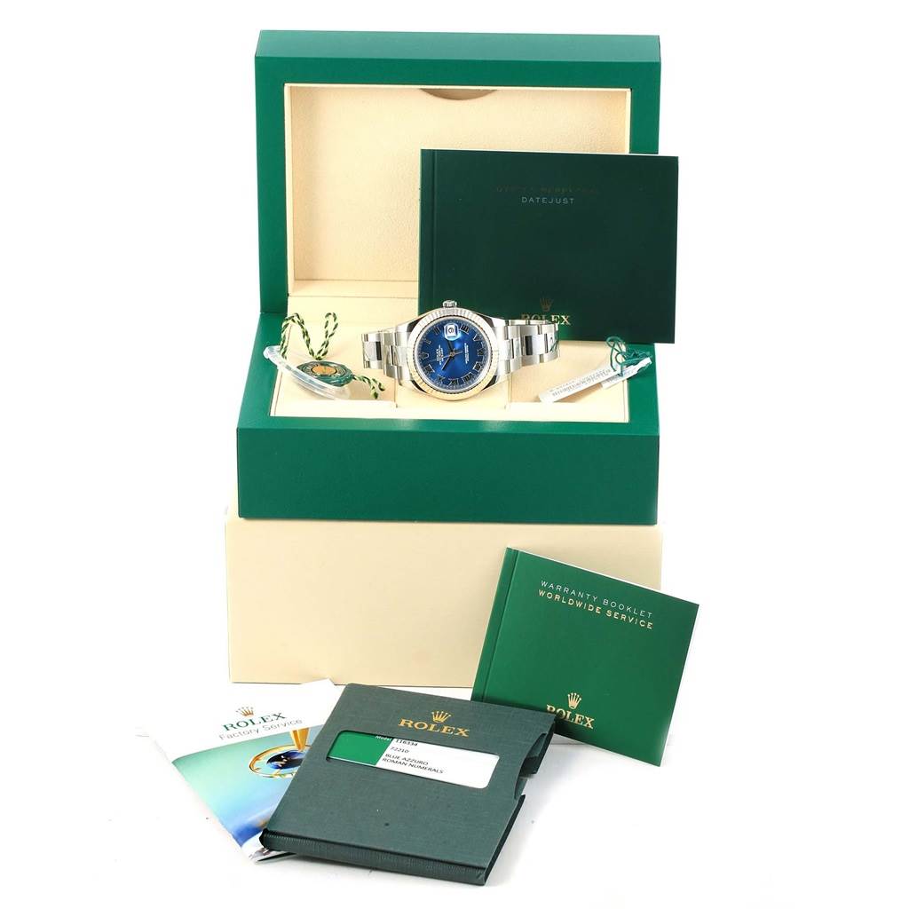 The image shows a Rolex Datejust 41 116334 Men's Stainless Steel Blue Dial 116334 Men's Stainless Steel Blue Dial watch in a green box, with accompanying booklets and tags, all viewed from the front.