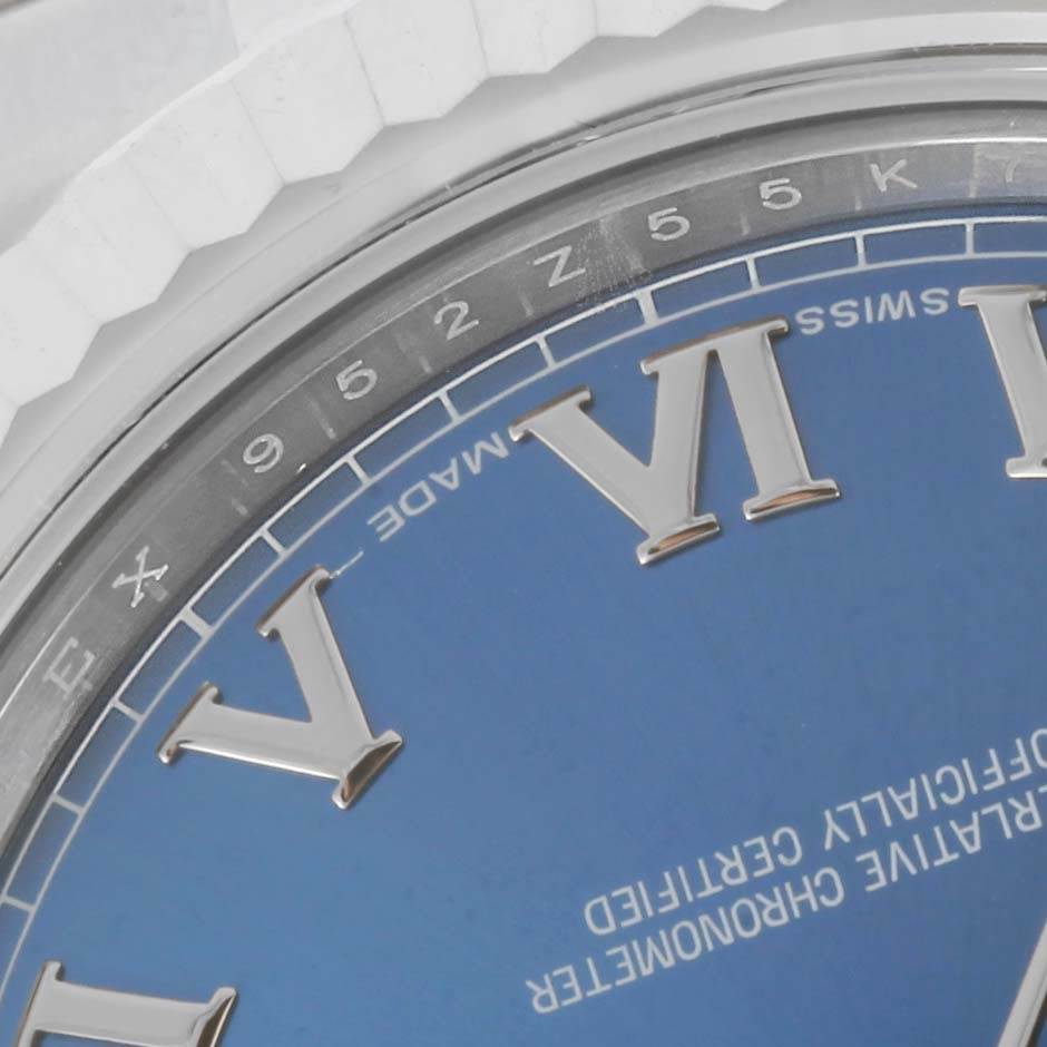 This close-up shows the Roman numerals and part of the flange on the dial of a Rolex Datejust 41 116334 Men's Stainless Steel Blue Dial 116334 Men's Stainless Steel Blue Dial watch.