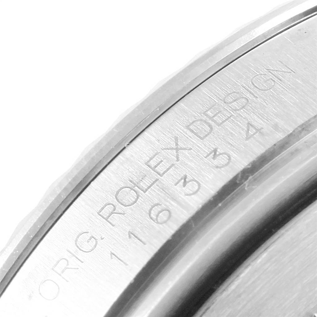 This image shows a close-up of the etched text on the case back of a Rolex Datejust 41 116334 Men's Stainless Steel Grey Dial 116334 Men's Stainless Steel Grey Dial model.
