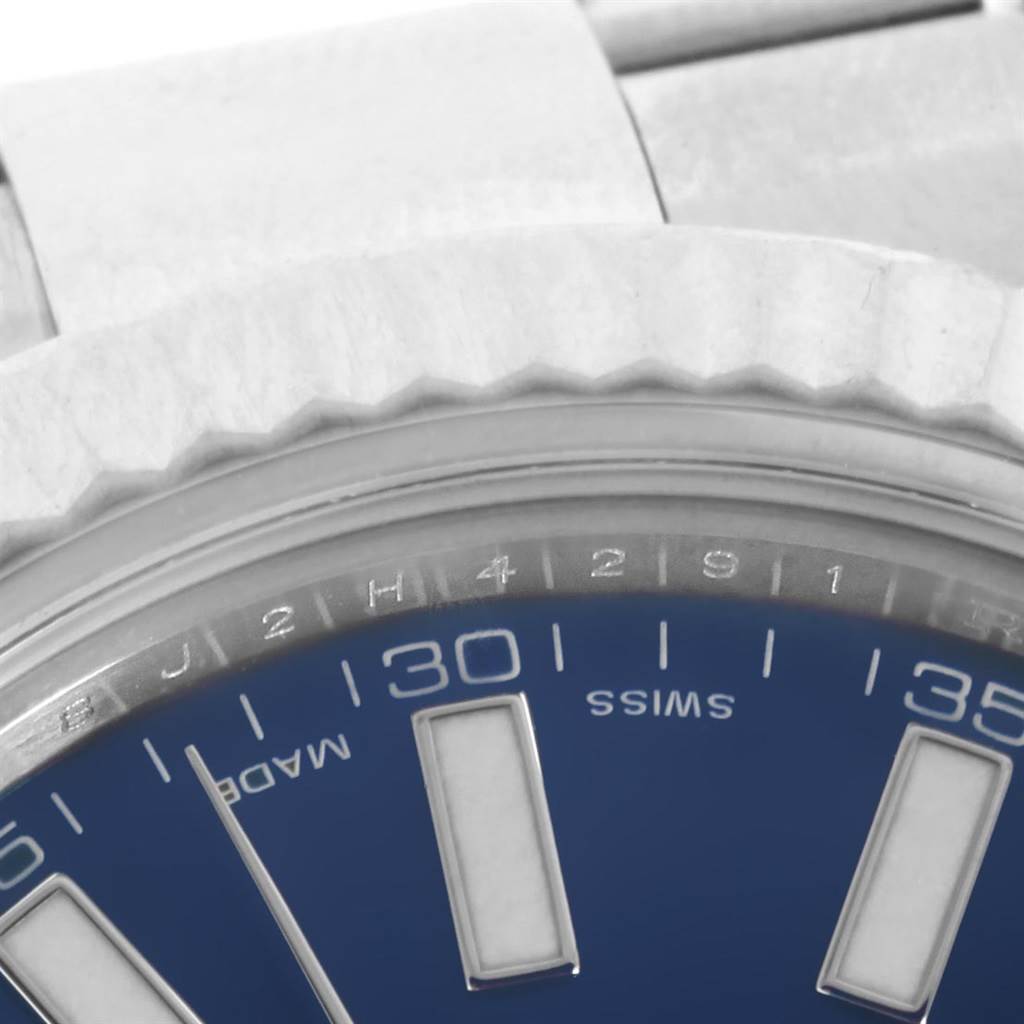 This close-up image of the Rolex Datejust 41 116334 Men's Stainless Steel Blue Dial 116334 Men's Stainless Steel Blue Dial shows part of the bezel, dial, and bracelet link.