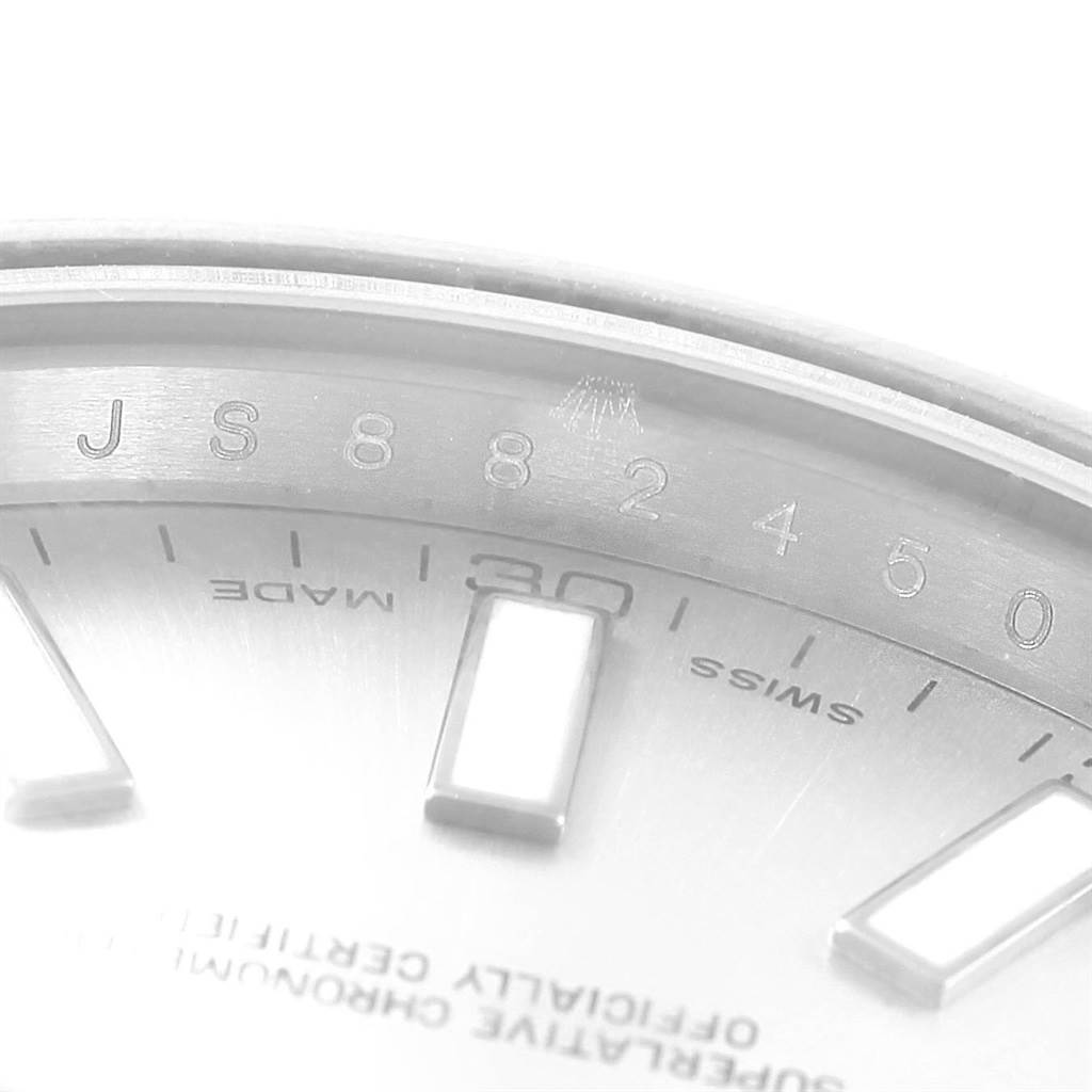 This image shows a close-up view of the dial and part of the bezel of a Rolex Datejust 41 116300 Men's Stainless Steel Silver Dial 116300 Men's Stainless Steel Silver Dial watch, emphasizing the markers and inscriptions.