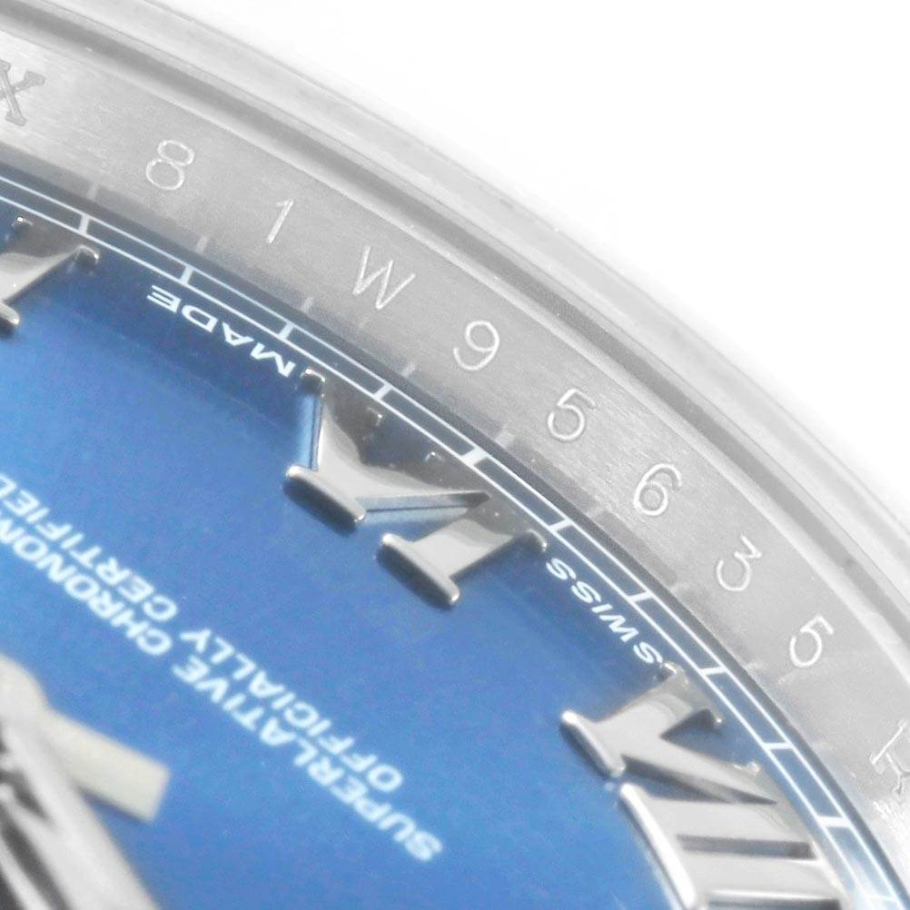The image shows a close-up of the dial and bezel of a Rolex Datejust 41 116300 Men's Stainless Steel Blue Dial 116300 Men's Stainless Steel Blue Dial, revealing the Roman numeral markers, part of the blue dial, and the outer ring with minute markers.
