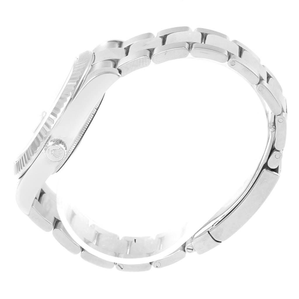 The image shows a side view of a Rolex Datejust 41 116334 Men's Stainless Steel Blue Dial 116334 Men's Stainless Steel Blue Dial watch, highlighting its crown, bezel, and bracelet.