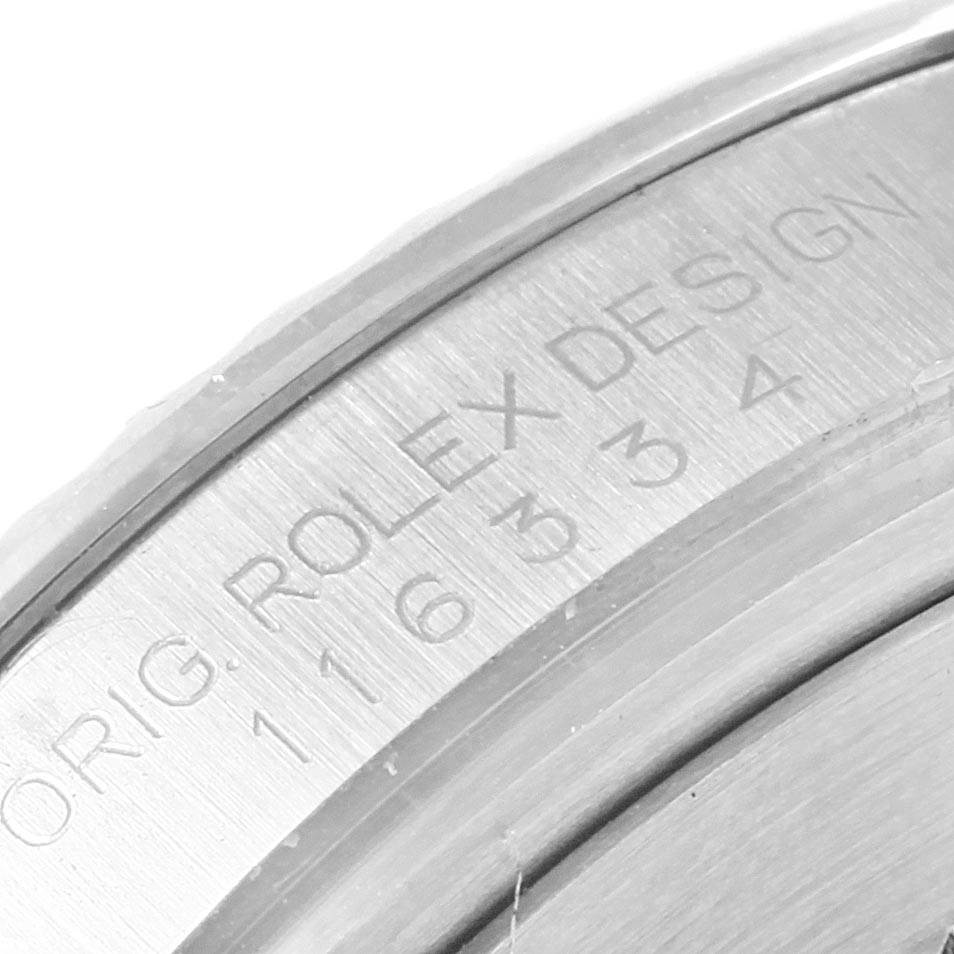 The image shows a close-up view of the case back engraving of the Rolex Datejust 41 116334 Men's Stainless Steel Blue Dial 116334 Men's Stainless Steel Blue Dial.