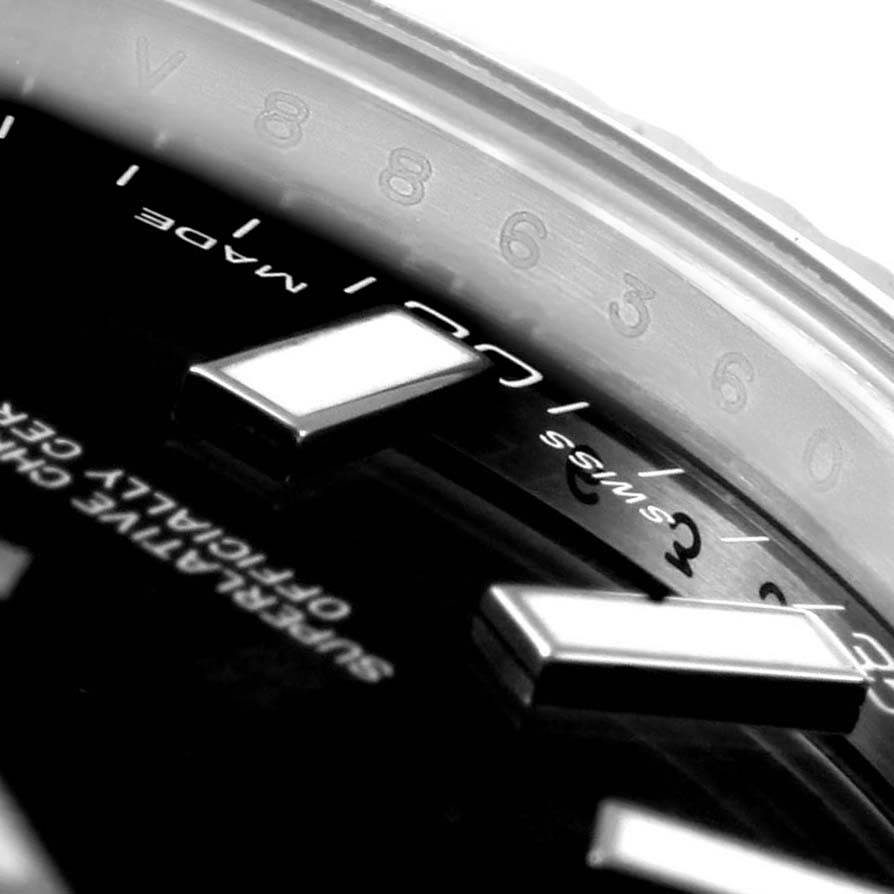The image shows an extreme close-up angle of the dial and bezel, highlighting the markers and "Swiss Made" text on a Rolex Datejust 41 116334 Men's Stainless Steel Black Dial 116334 Men's Stainless Steel Black Dial model.