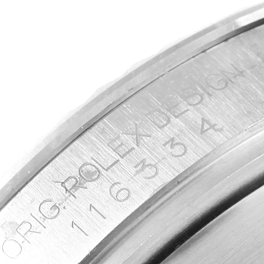 The image shows a close-up of the engraved markings on the case back of a Rolex Datejust 41 116334 Men's Stainless Steel Black Dial 116334 Men's Stainless Steel Black Dial watch.