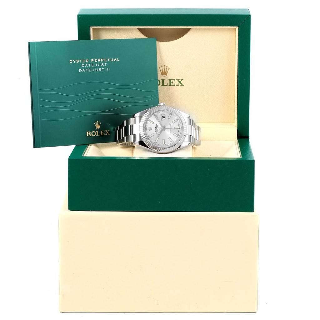 The Rolex Datejust 41 116334 Men's Stainless Steel Silver Dial 116334 Men's Stainless Steel Silver Dial model is shown at a front angle inside its box along with its instruction manual.