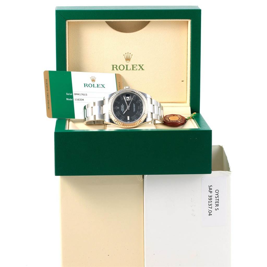 The Rolex Datejust 41 116334 Men's Stainless Steel Grey Dial 116334 Men's Stainless Steel Grey Dial watch is displayed in an open box, showing the face, bracelet, and accompanying warranty card.