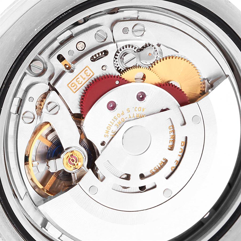 This image shows the internal mechanism of a Rolex Datejust 41 116334 Men's Stainless Steel Silver Dial 116334 Men's Stainless Steel Silver Dial, including its gears, rotor, and balance wheel, viewed from the back.