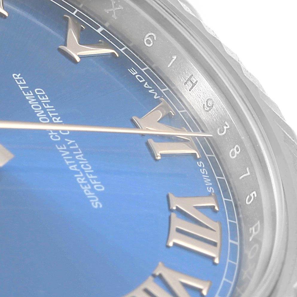 The image shows a close-up of the blue dial with Roman numerals and part of the bezel of a Rolex Datejust 41 116334 Men's Stainless Steel Blue Dial 116334 Men's Stainless Steel Blue Dial.