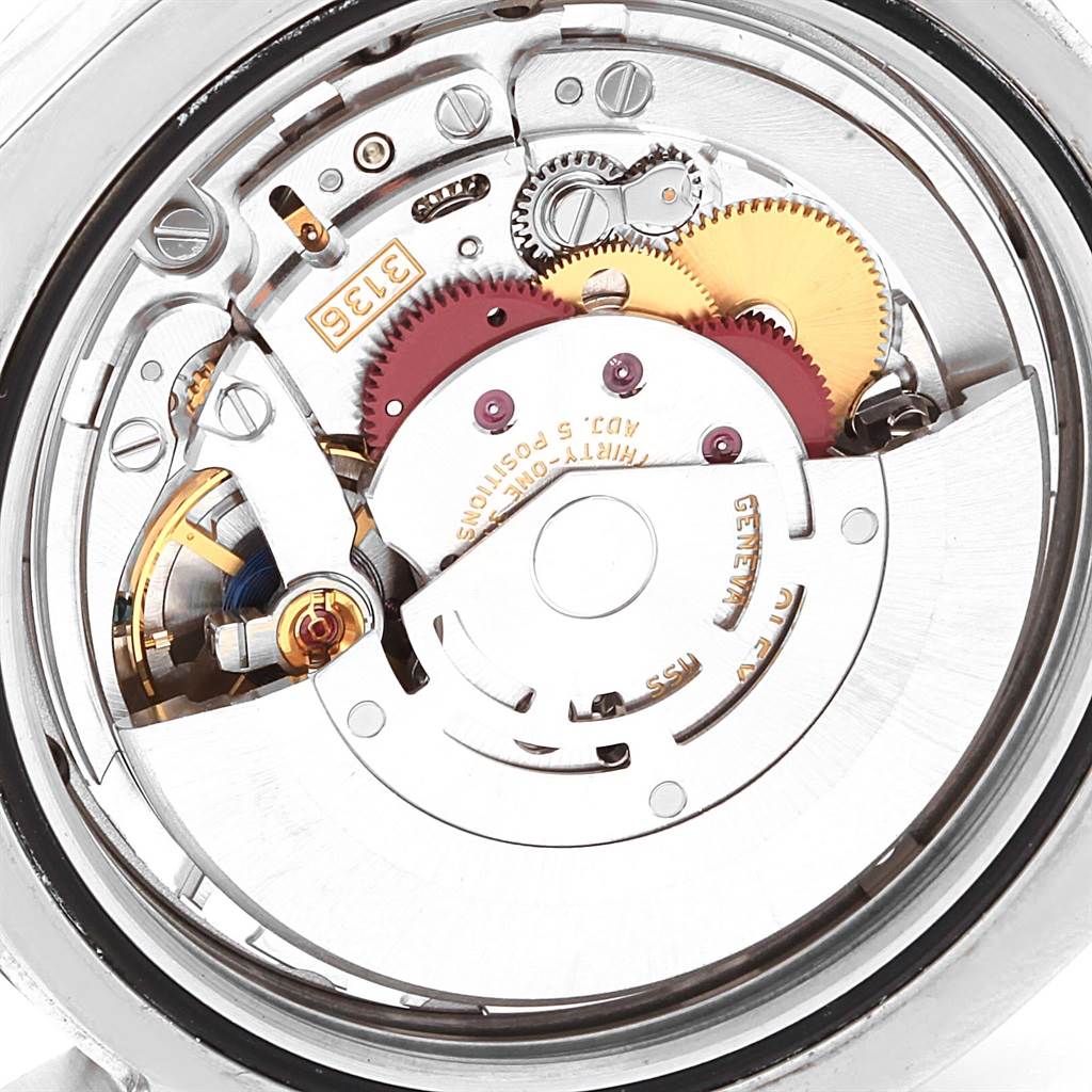 The image displays the internal movement mechanism of a Rolex Datejust 41 116334 Men's Stainless Steel Blue Dial 116334 Men's Stainless Steel Blue Dial watch, showing gears and intricate components.