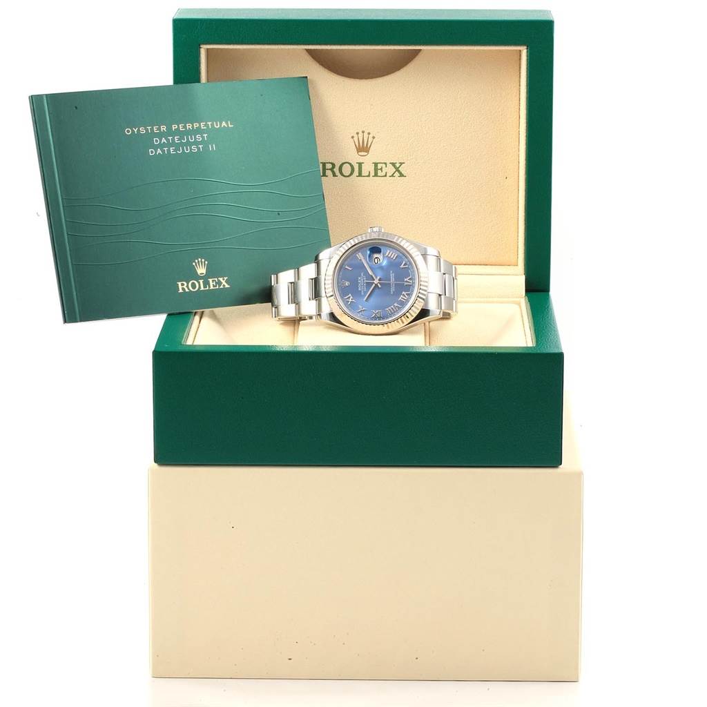 The image shows a Rolex Datejust 41 116334 Men's Stainless Steel Blue Dial 116334 Men's Stainless Steel Blue Dial watch in its box with a manual next to it, viewed from the front.