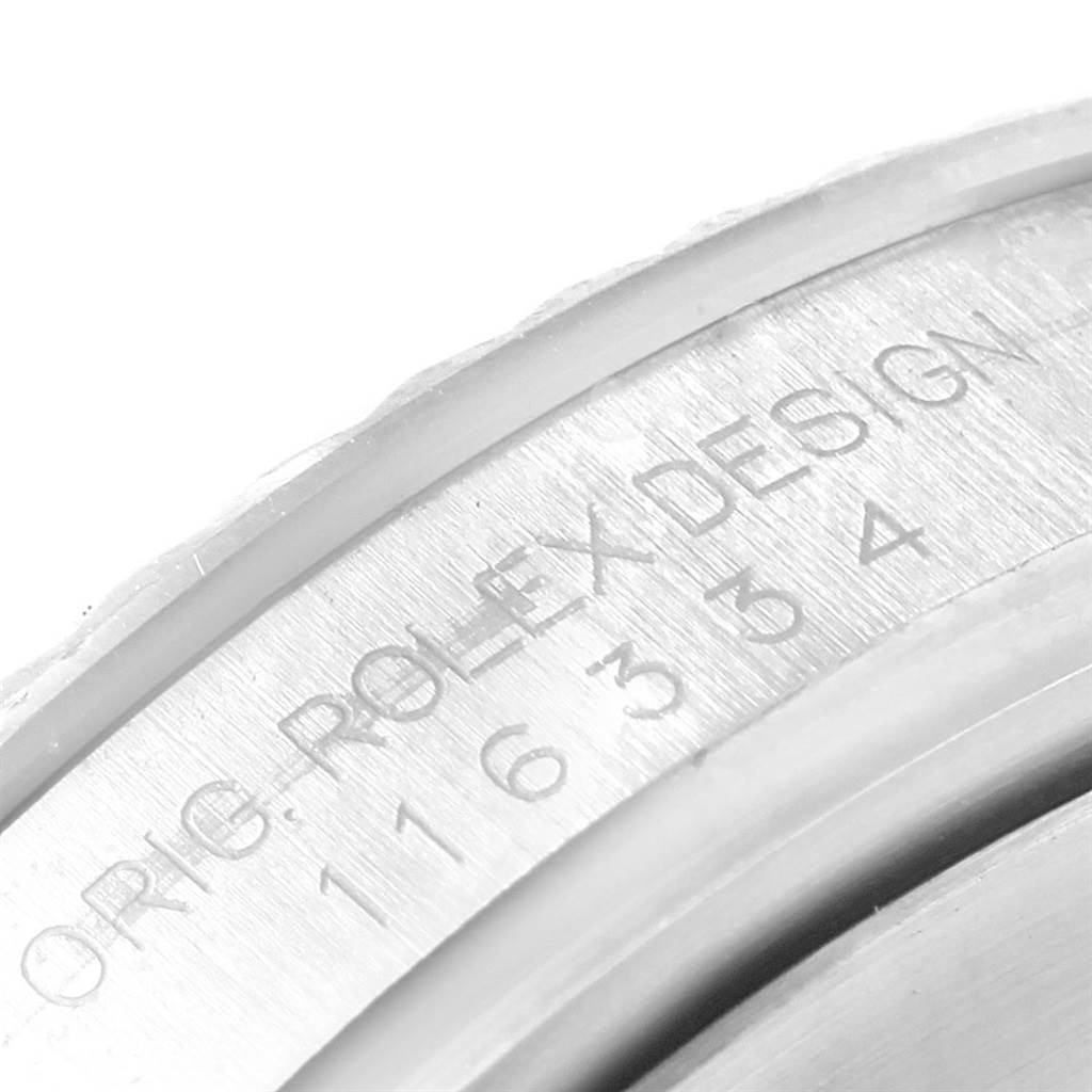 This close-up image shows the engraved inner bezel of a Rolex Datejust 41 116334 Men
s Stainless Steel Grey Dial 116334 Men
s Stainless Steel Grey Dial watch.