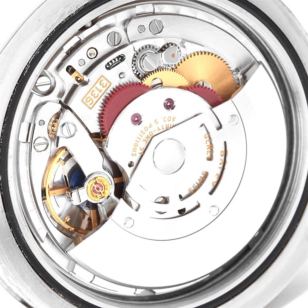 The image shows a close-up view of the movement mechanism of the Rolex Datejust 41 116334 Men's Stainless Steel Blue Dial 116334 Men's Stainless Steel Blue Dial watch.