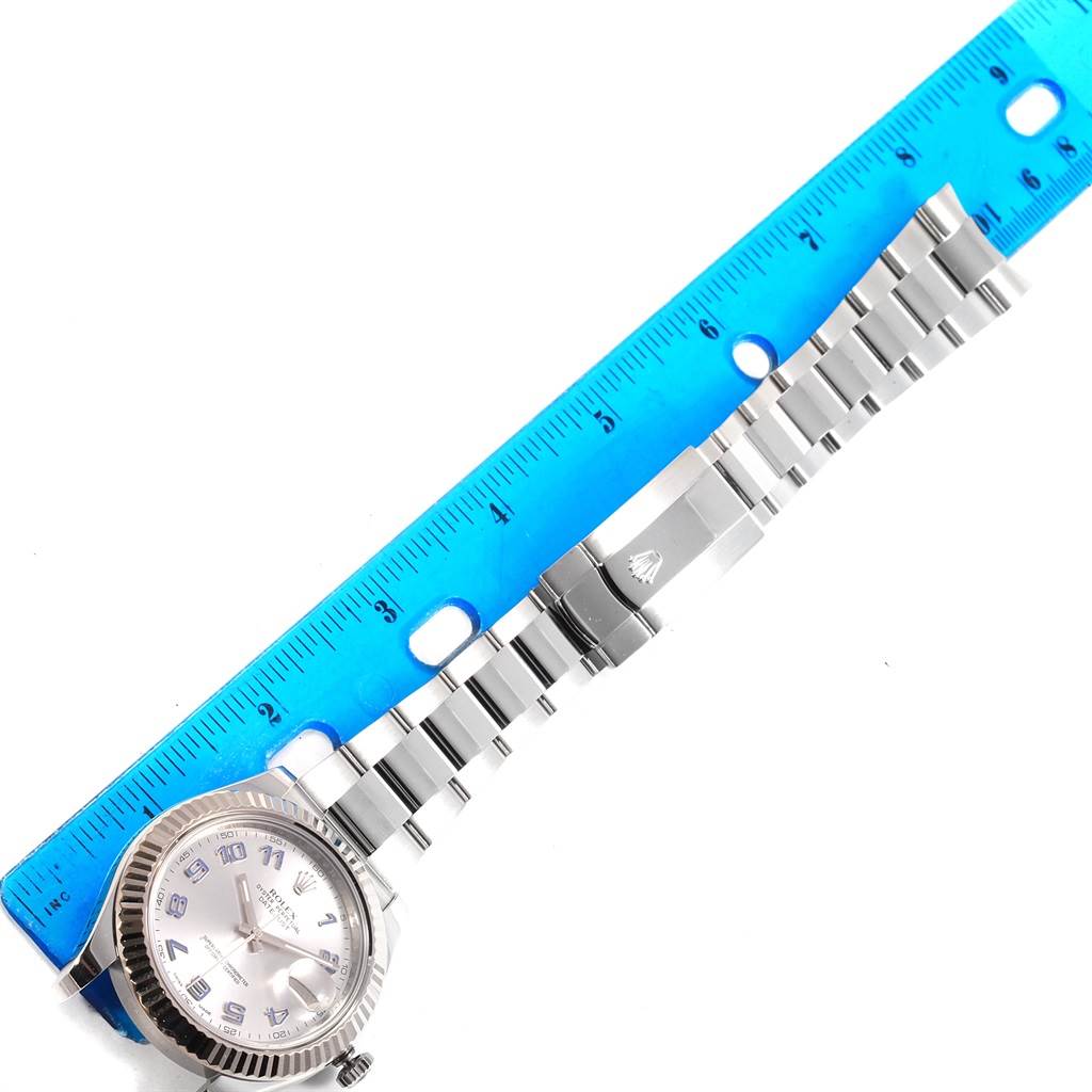 The image shows a Rolex Datejust 41 116334 Men's Stainless Steel Grey Dial 116334 Men's Stainless Steel Grey Dial watch laid flat with its bracelet extended and a blue ruler for scale.