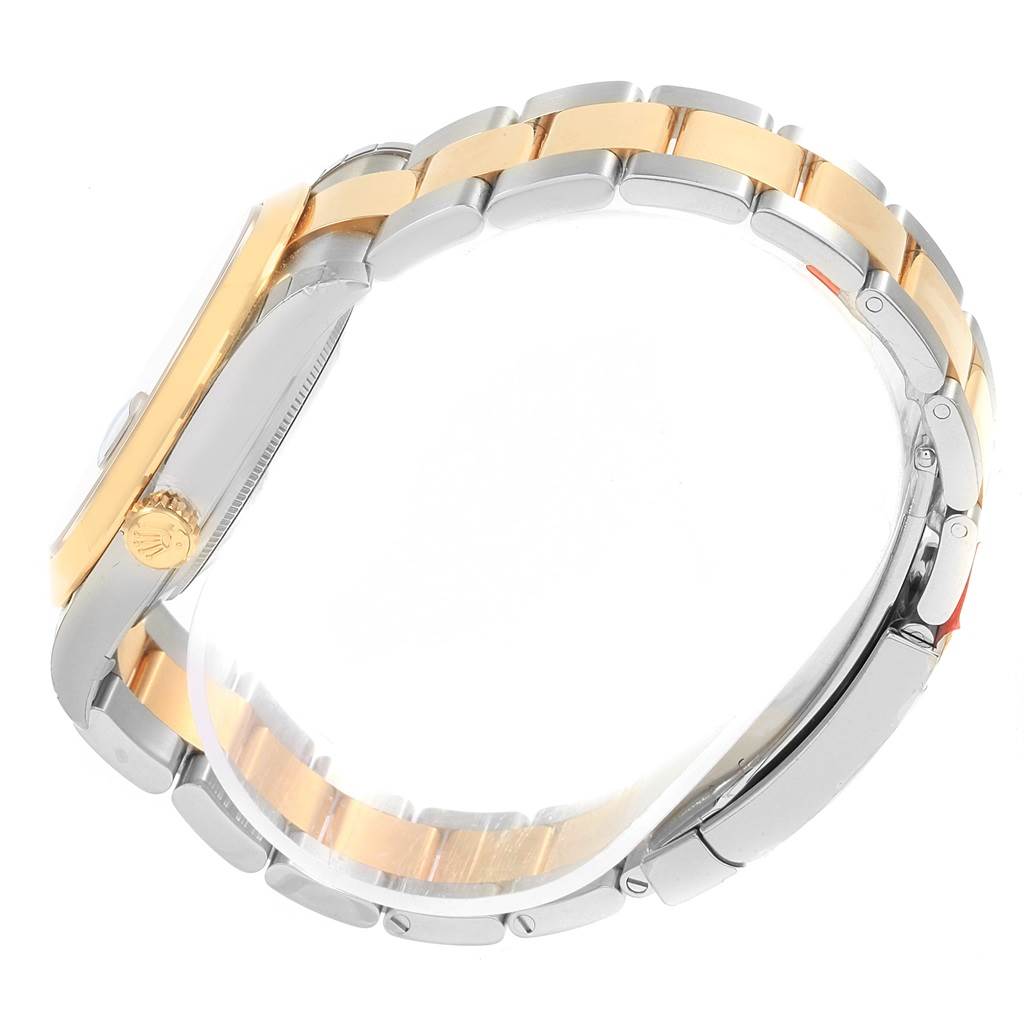 The image shows the side view of a Rolex Datejust 41 126303 Men's Steel and Gold (two tone) Black Dial 126303 Men's Steel and Gold (two tone) Black Dial, highlighting the two-tone bracelet and crown.