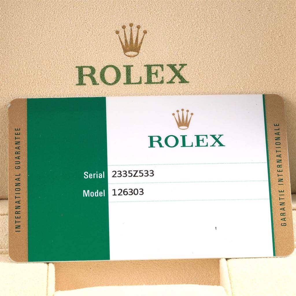 The image shows a Rolex warranty card for the Datejust 41 model, including the serial number and model number.