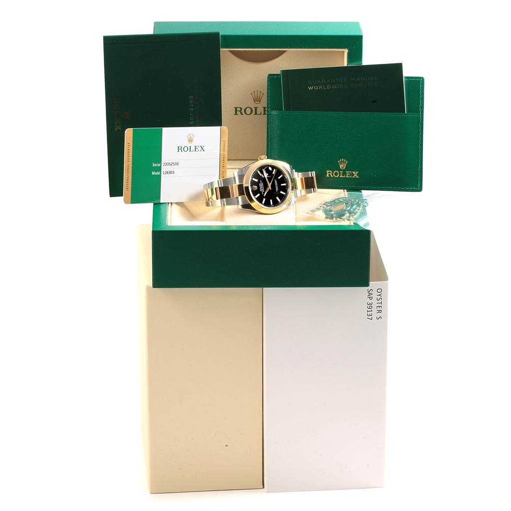 The Rolex Datejust 41 126303 Men's Steel and Gold (two tone) Black Dial 126303 Men's Steel and Gold (two tone) Black Dial watch is displayed frontally along with its box, warranty card, and booklets.