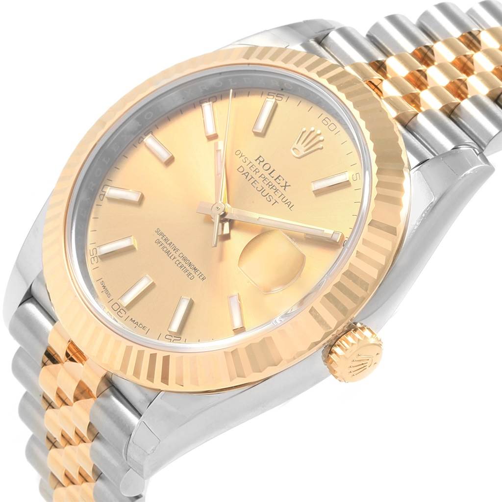The image shows a close-up of the Rolex Datejust 41 126333 Men
s Steel and Gold (two tone) Champagne Dial 126333 Men
s Steel and Gold (two tone) Champagne Dial, highlighting its gold dial, fluted bezel, and Jubilee bracelet.