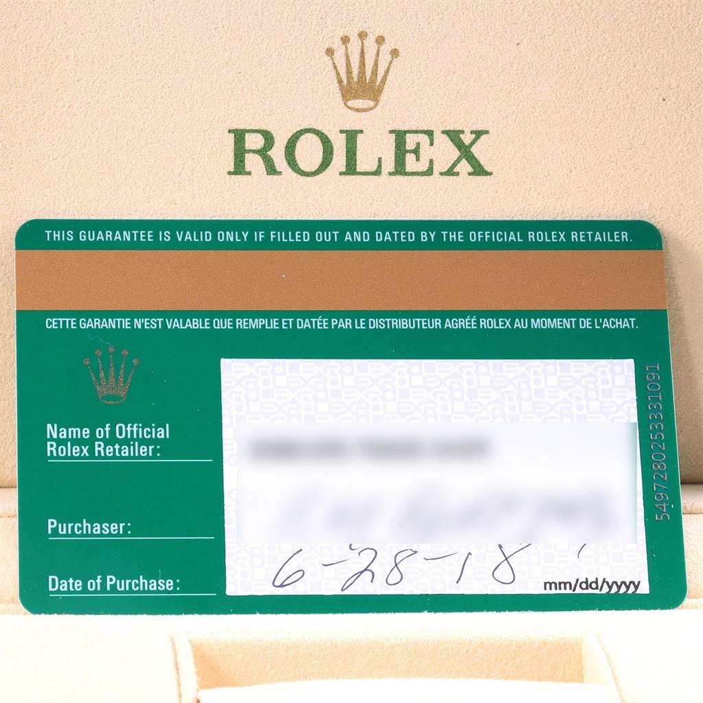 The image shows the warranty card of a Rolex Datejust 41 126333 Men
s Steel and Gold (two tone) Champagne Dial 126333 Men
s Steel and Gold (two tone) Champagne Dial, placed inside the brand
s packaging, viewed from above.