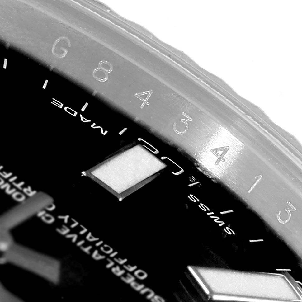 The image shows a close-up of the dial and bezel of a Rolex Datejust 41 116334 Men's Stainless Steel Black Dial 116334 Men's Stainless Steel Black Dial watch, highlighting its numerals and markers.