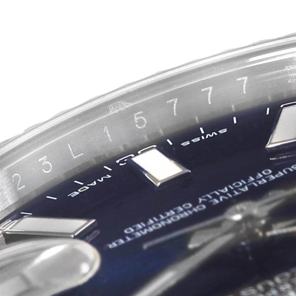 The image shows a close-up of a Rolex Datejust 41 116334 Men's Stainless Steel Blue Dial 116334 Men's Stainless Steel Blue Dial dial, highlighting the indices, Swiss Made text, and part of the hands.