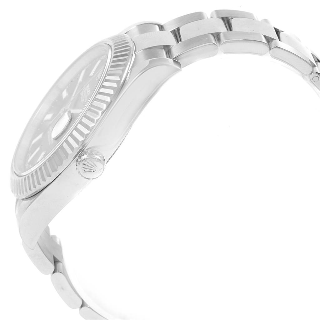 The image shows a side view of the Rolex Datejust 41 116334 Men's Stainless Steel Blue Dial 116334 Men's Stainless Steel Blue Dial watch, focusing on the case, fluted bezel, crown, and part of the bracelet.