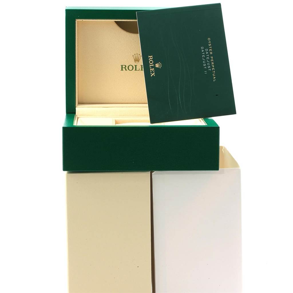 The image shows the box and papers for the Rolex Datejust 41 116334 Men's Stainless Steel Blue Dial 116334 Men's Stainless Steel Blue Dial, with the box open and the accompanying green booklet.