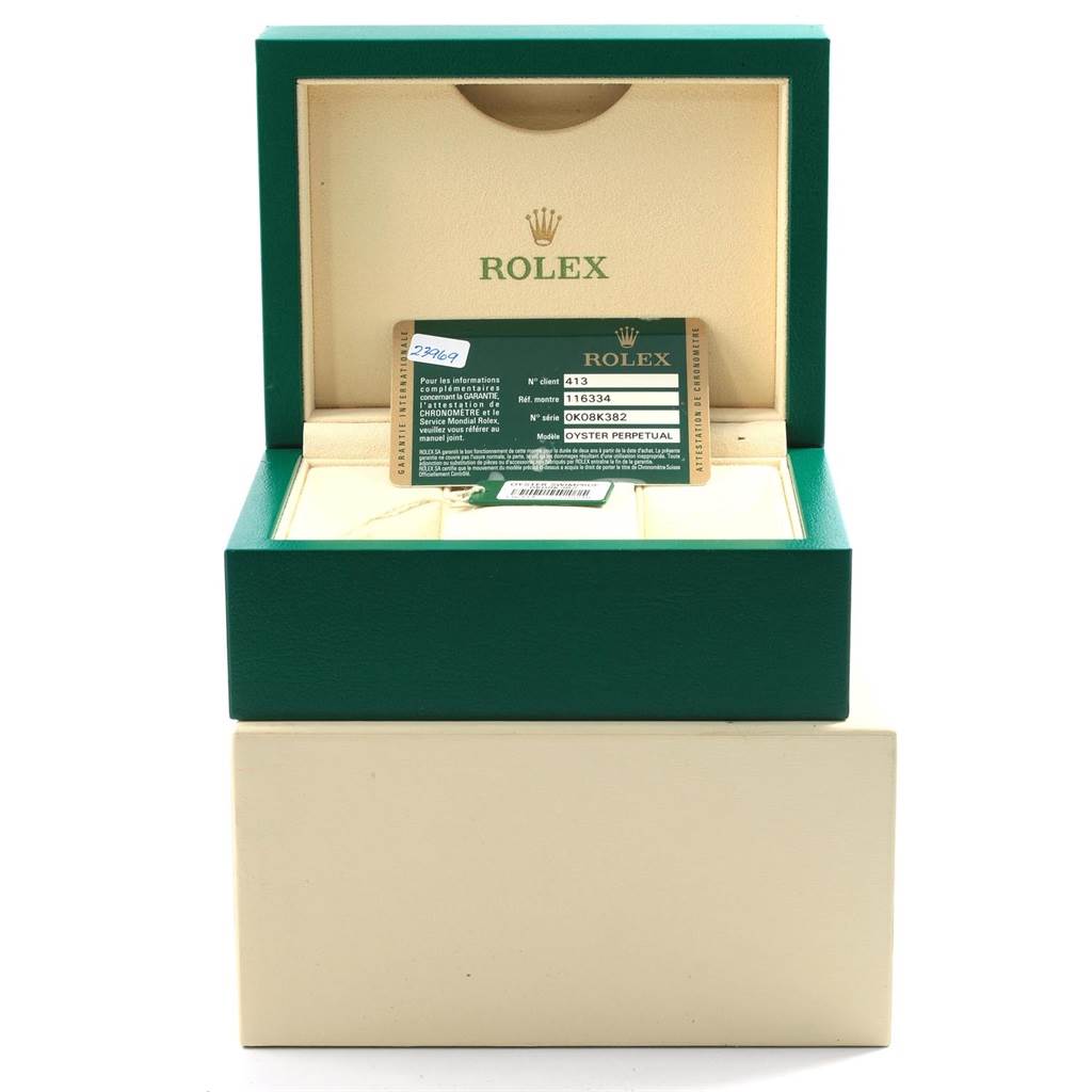 The image shows the open box of a Rolex Datejust 41 116334 Men's Stainless Steel Blue Dial 116334 Men's Stainless Steel Blue Dial with the warranty card and tag inside.