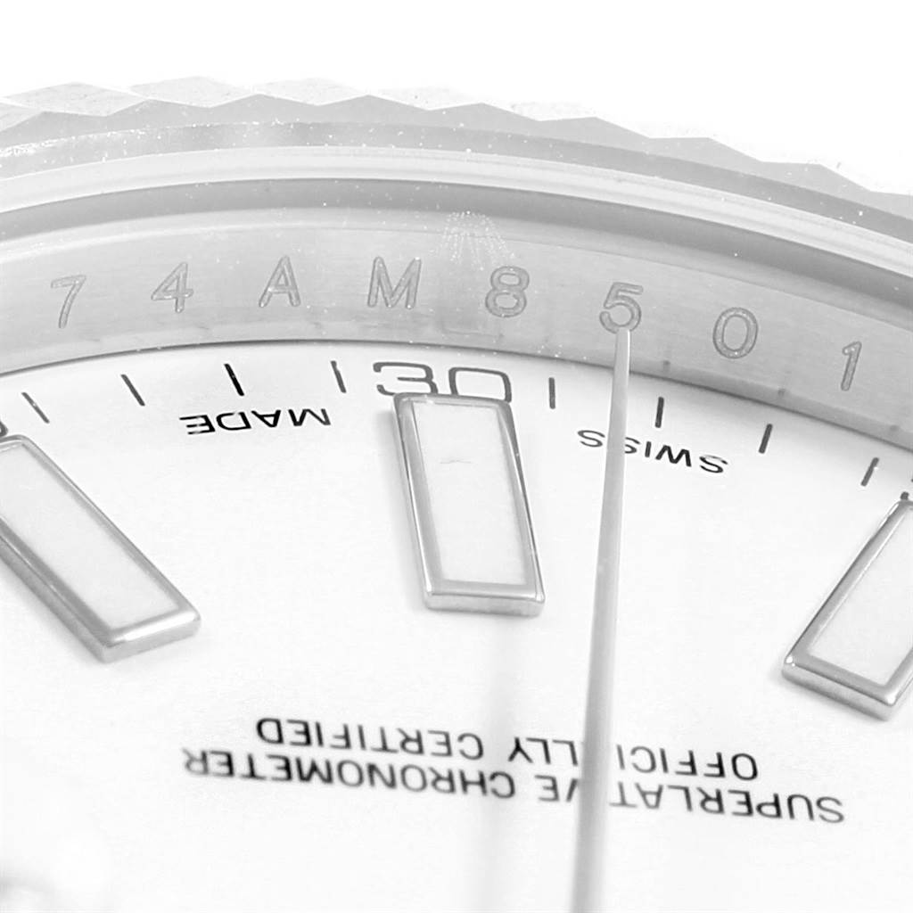 This close-up image shows part of the dial and bezel of a Rolex Datejust 41 116334 Men's Stainless Steel White Dial 116334 Men's Stainless Steel White Dial watch, highlighting numerals and markers.