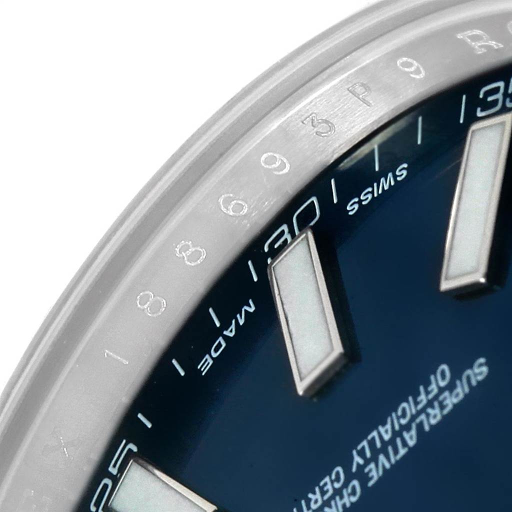This image shows a close-up of the dial, bezel, and part of the hour markers of the Rolex Datejust 41 116300 Men's Stainless Steel Blue Dial 116300 Men's Stainless Steel Blue Dial watch.
