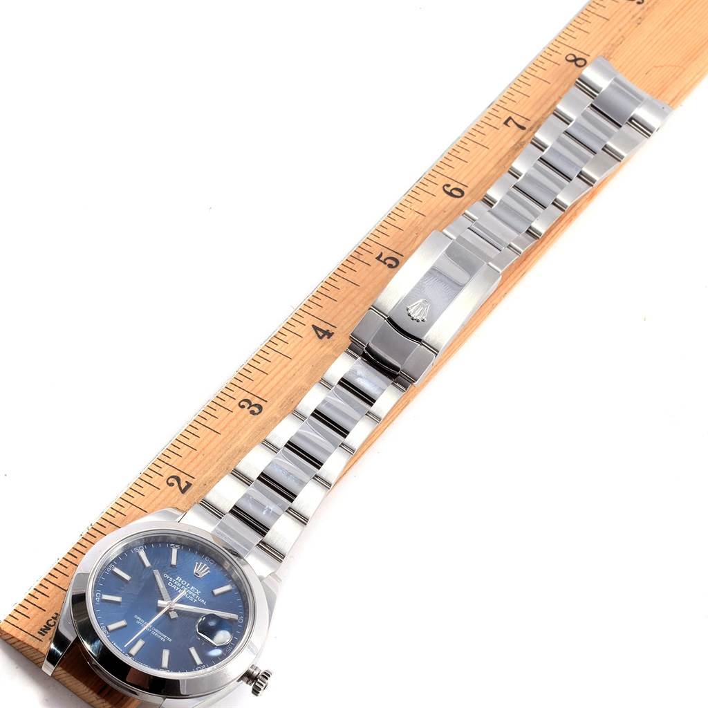 The Rolex Datejust 41 126300 Men's Stainless Steel Blue Dial 126300 Men's Stainless Steel Blue Dial watch is shown lying flat, with its blue dial, stainless steel bracelet, and clasp fully visible.