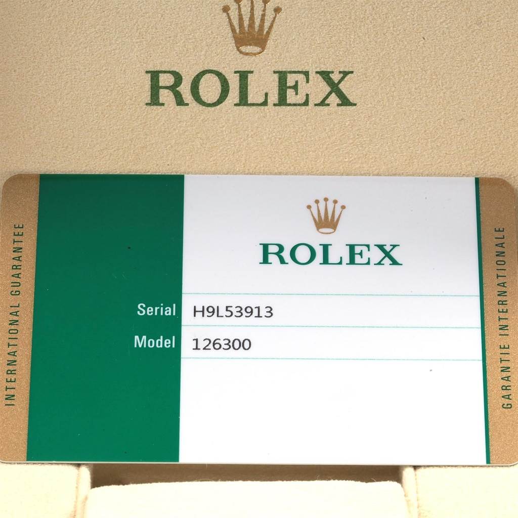 This image shows the warranty card for a Rolex Datejust 41 126300 Men's Stainless Steel Blue Dial 126300 Men's Stainless Steel Blue Dial model, displaying the brand logo, serial number, and model number.
