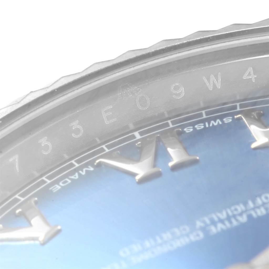 This image shows a close-up view of part of the dial and engraving on the bezel of the Rolex Datejust 41 116334 Men's Stainless Steel Blue Dial 116334 Men's Stainless Steel Blue Dial model.