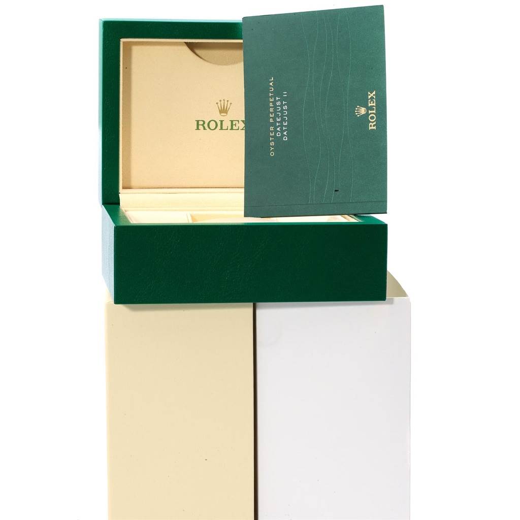The image shows an open green Rolex box for a Datejust 41 model with its warranty booklet displayed.