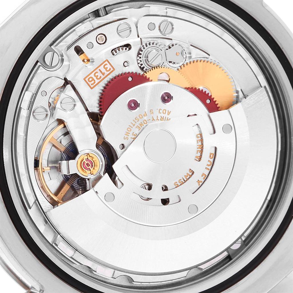 The image shows a close-up of the Rolex Datejust 41 116334 Men's Stainless Steel Blue Dial 116334 Men's Stainless Steel Blue Dial watch movement, highlighting internal gears and mechanisms.