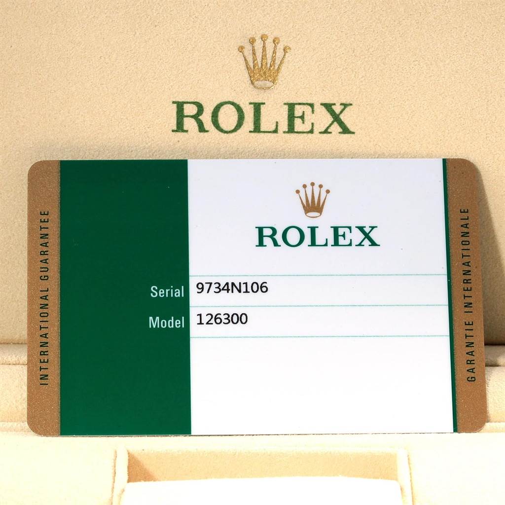 This image shows a close-up of the Rolex guarantee card for the Datejust 41 model, placed against a Rolex-branded background.