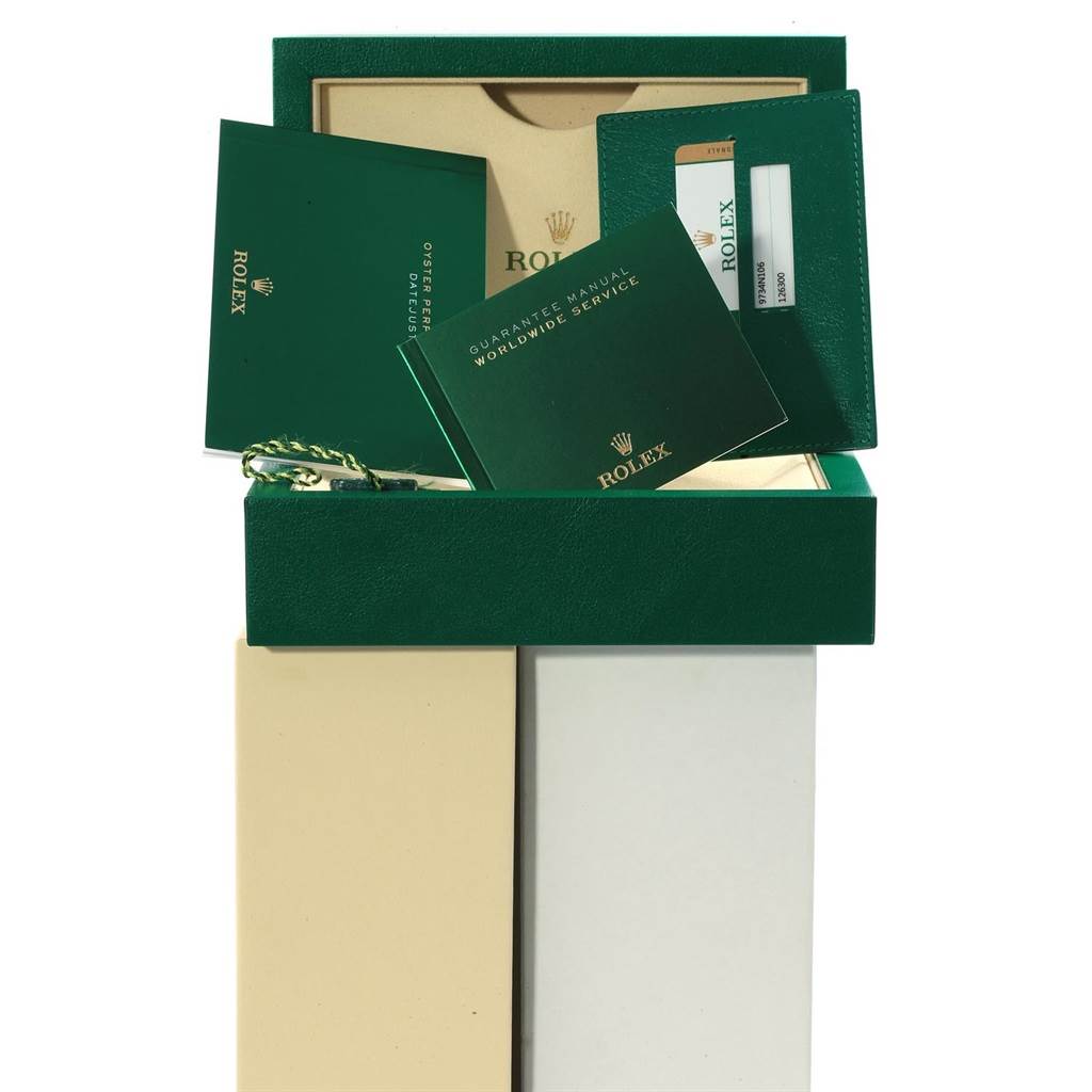 The image shows the packaging and accessories for a Rolex Datejust 41 126300 Men's Stainless Steel White Dial 126300 Men's Stainless Steel White Dial, including manuals and a guarantee card holder.