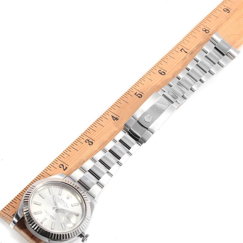 The image shows a Rolex Datejust 41 116334 Men's Stainless Steel Silver Dial 116334 Men's Stainless Steel Silver Dial watch laid flat next to a ruler, displaying the watch face and bracelet.