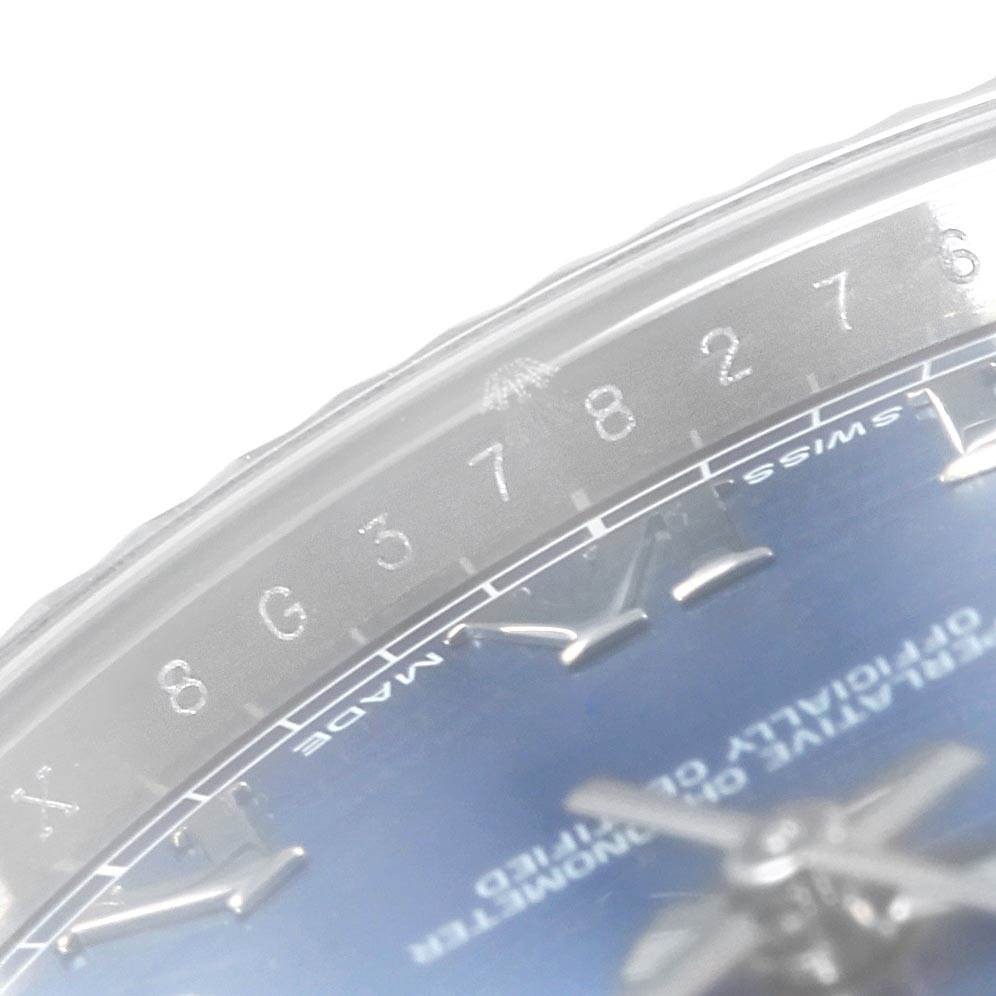 The image shows a close-up view of the Rolex Datejust 41 116334 Men's Stainless Steel Blue Dial 116334 Men's Stainless Steel Blue Dial watch dial and part of the bezel, highlighting the numbers and hour markers.