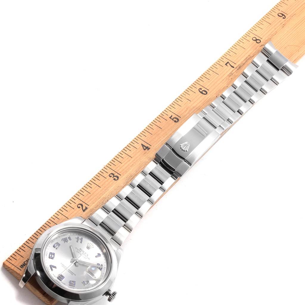 The Rolex Datejust 41 116300 Men's Stainless Steel Silver Dial 116300 Men's Stainless Steel Silver Dial watch is shown flat, with the full face, bracelet, and clasp visible next to a ruler indicating size.