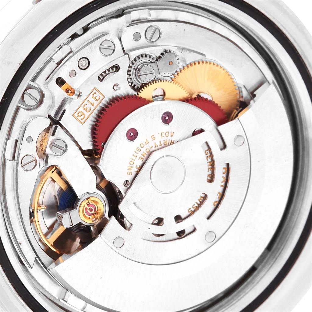 This is a close-up of the internal movement of a Rolex Datejust 41 116300 Men's Stainless Steel Silver Dial 116300 Men's Stainless Steel Silver Dial, showing gears and mechanical components.
