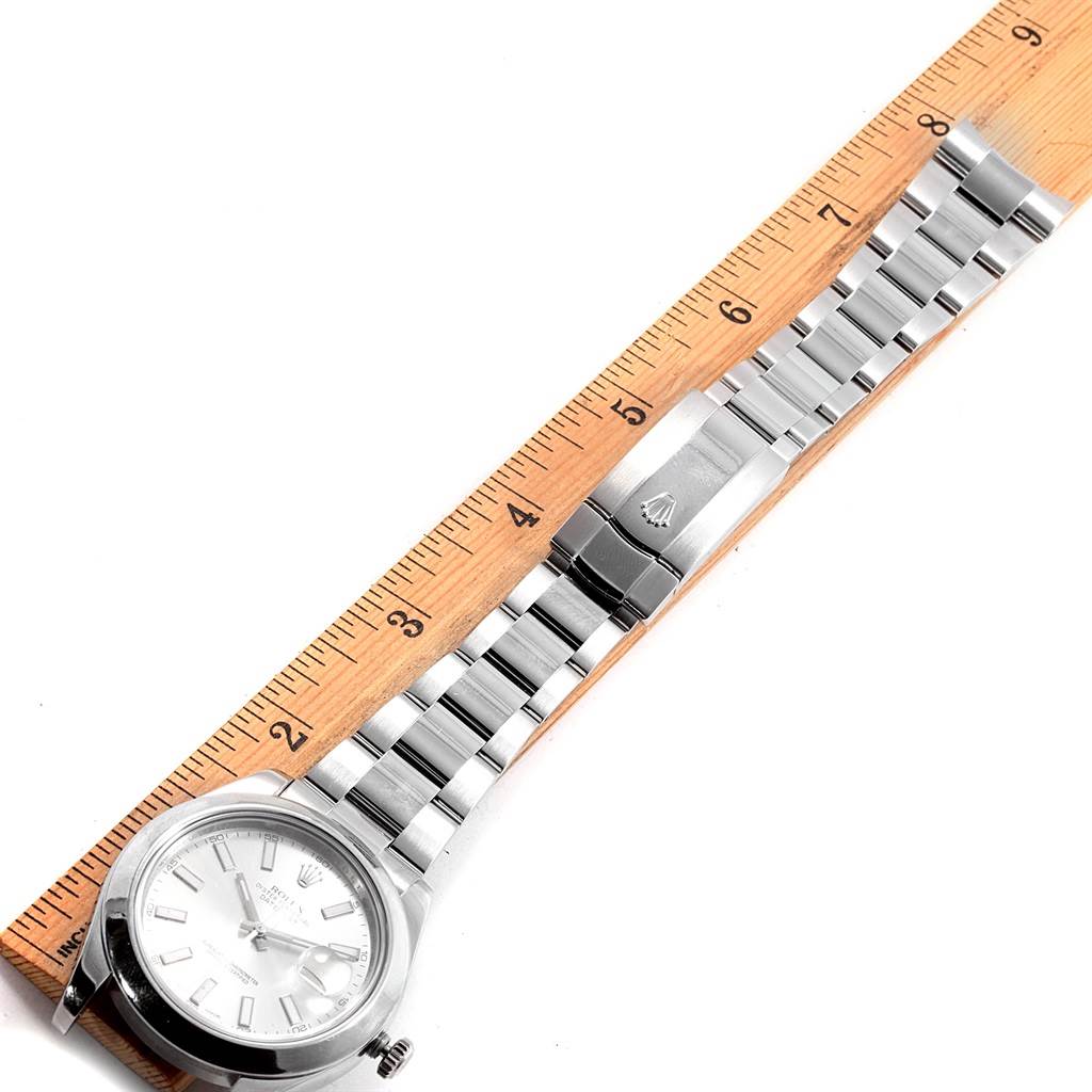 The image shows a Rolex Datejust 41 116300 Men's Stainless Steel Silver Dial 116300 Men's Stainless Steel Silver Dial watch laid flat next to a ruler, displaying the face, band, and clasp from a top-down angle.