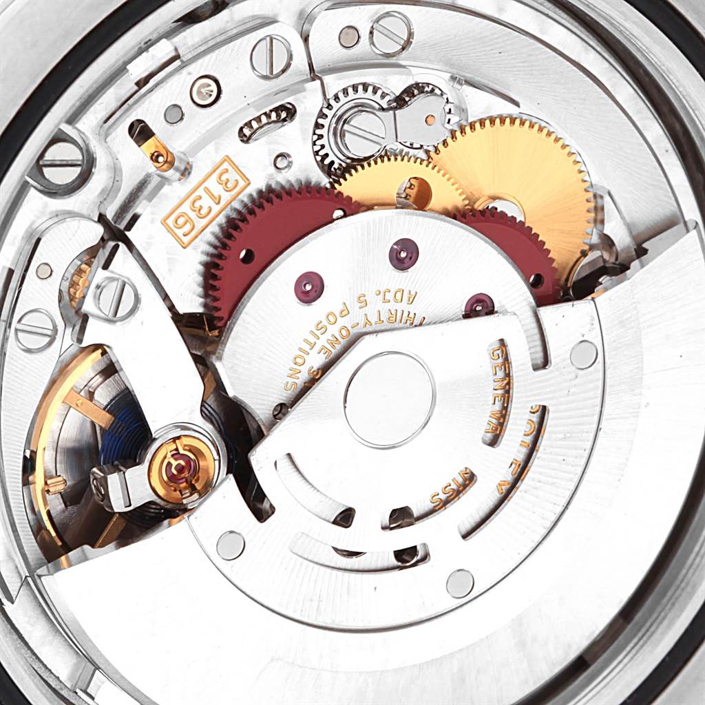 This is an internal, angled close-up of a Rolex Datejust 41 116300 Men's Stainless Steel Silver Dial 116300 Men's Stainless Steel Silver Dial watch mechanism, showing gears and intricate components.