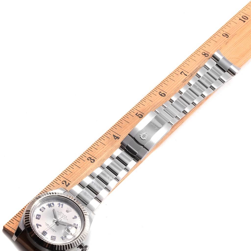 The image shows the Rolex Datejust 41 116334 Men's Stainless Steel Grey Dial 116334 Men's Stainless Steel Grey Dial watch laid horizontally with its stainless steel bracelet and clasp, alongside a ruler for size reference.